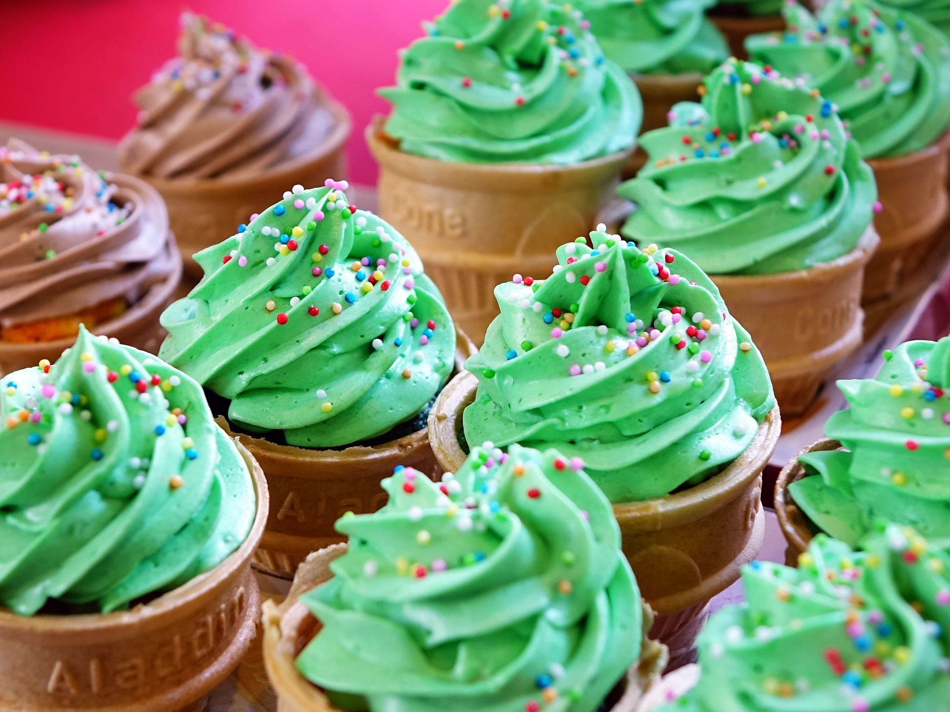 cupcakes with teal frosting and sprinkles